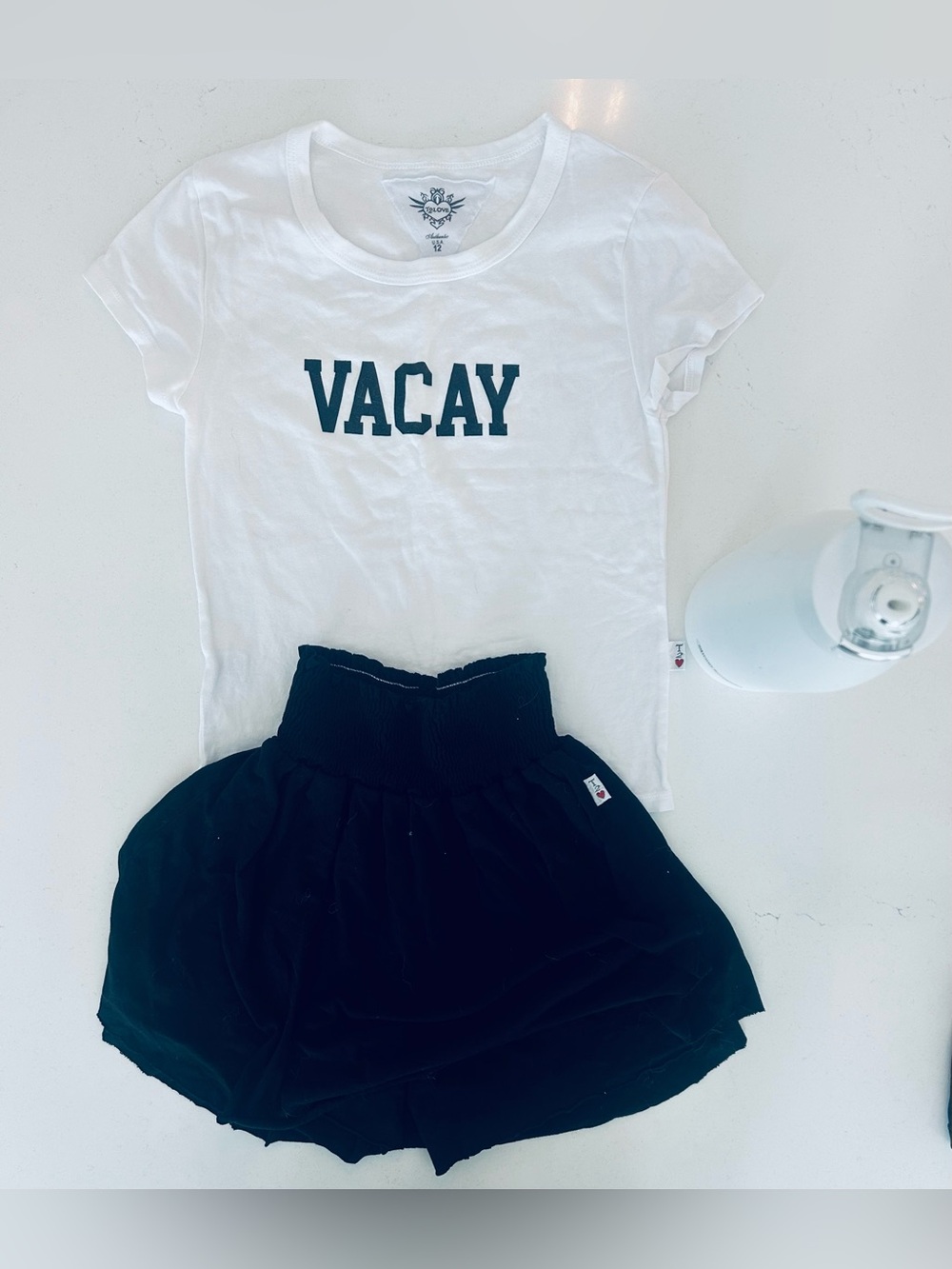 T2Love Girls Black Elastic Waist Skirt-Shorts with white VACAY tee and white fli
